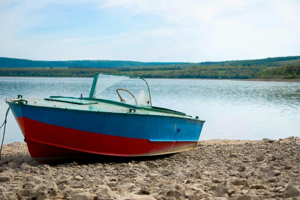 A modern aluminium fishing boat pulled up onto a quiet shore. Aluminium for Marine projects. Photo credit Oleksander Tomin